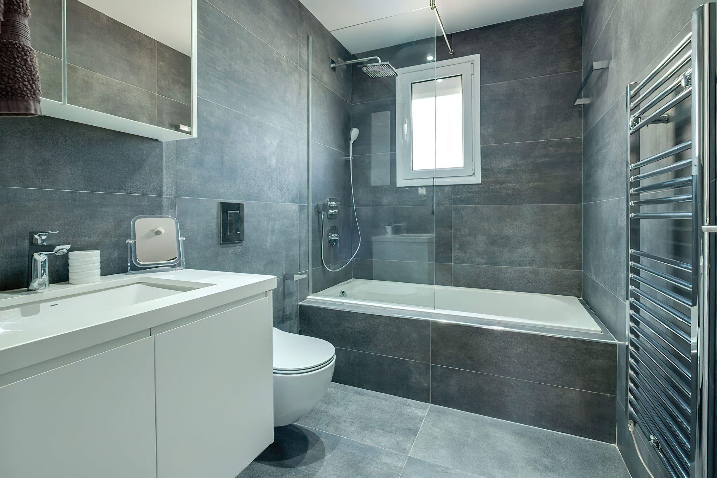 Family bathroom with bath, rain shower and heated towel rail