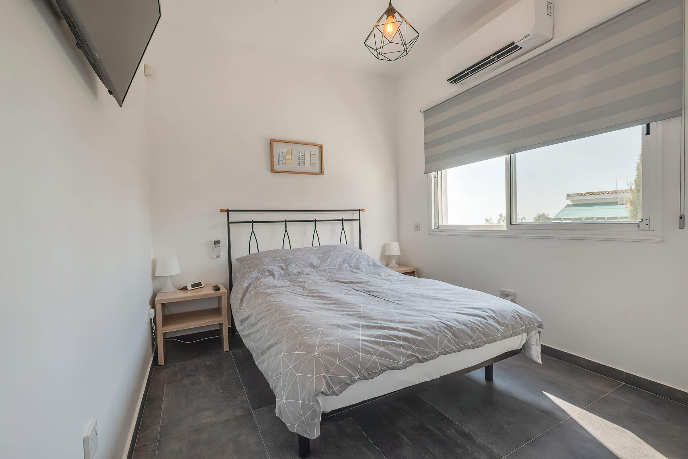 Double bedroom with air conditioning and bedside tables