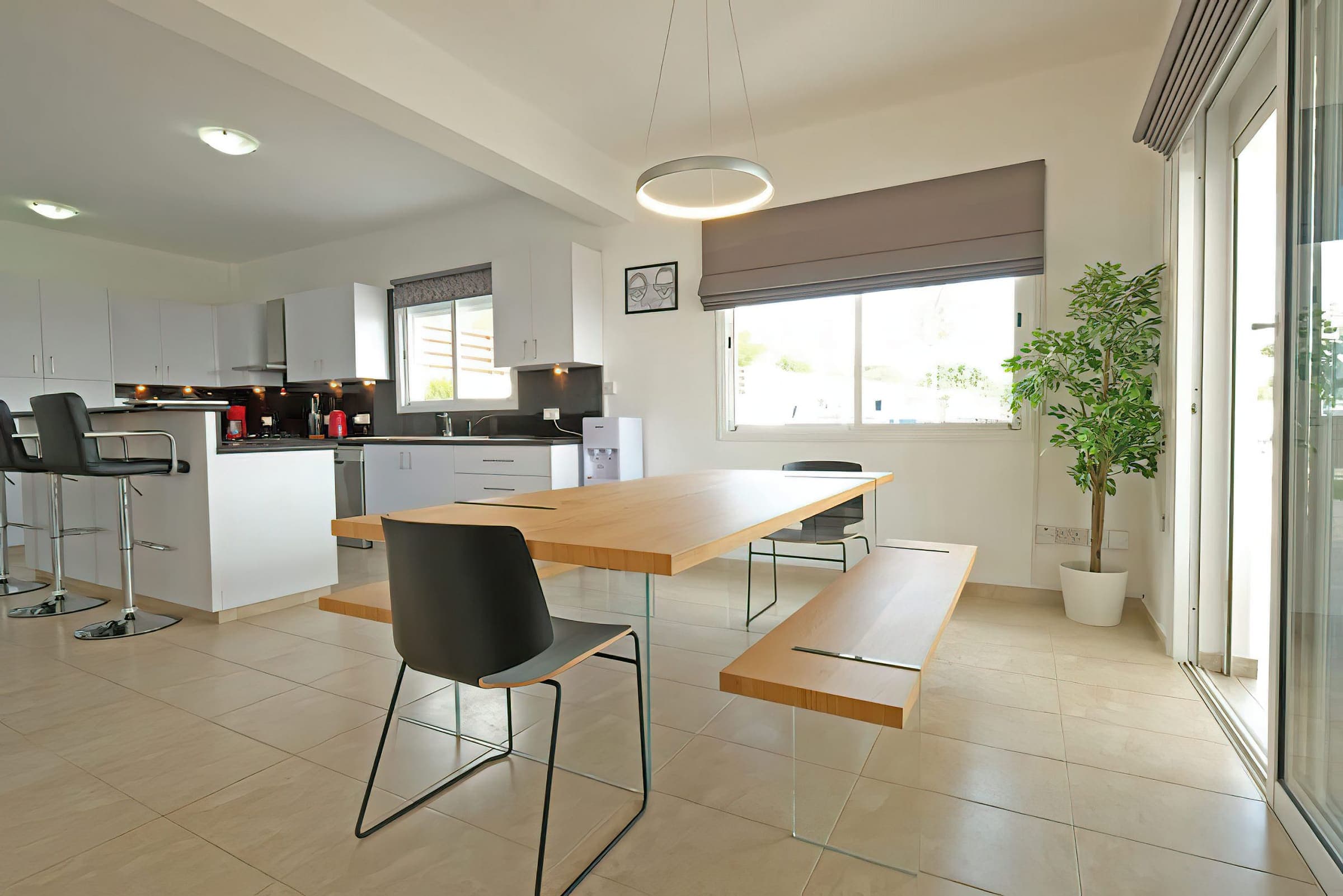Dining table beside the open-plan kitchen
