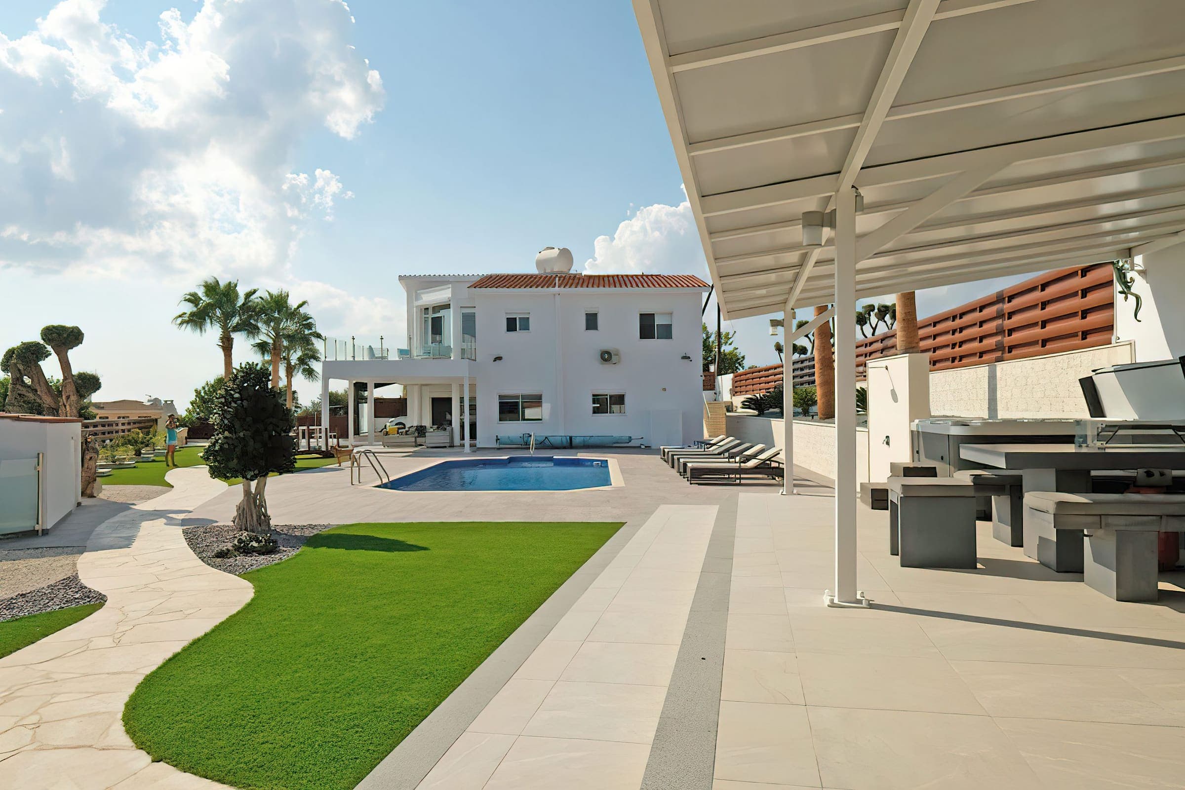 Garden path leading past the lawn to the pool and covered dining area